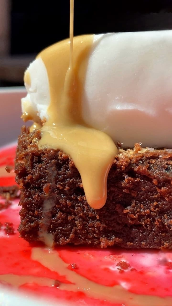 TAHINI BROWNIE with raspberry sauce