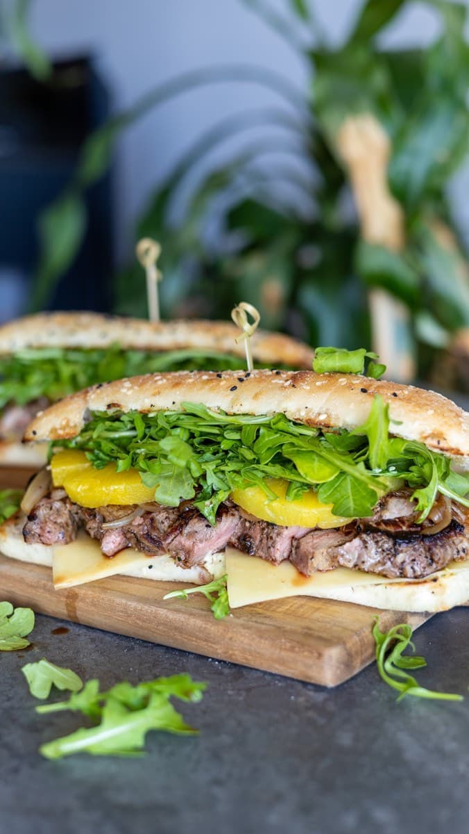 Pan-fried steak with caramelised onions and a creamy pesto sauce